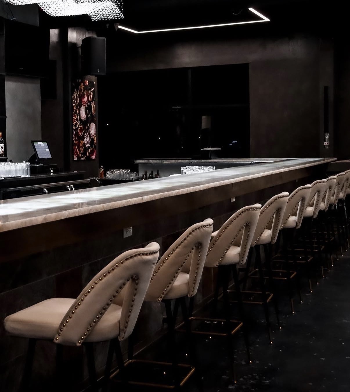 Lux Lounge long bar with cream tufted stools